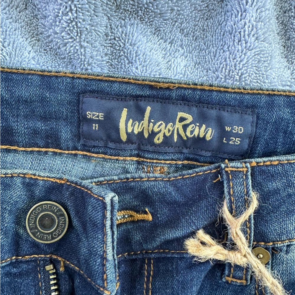 Indigo Rein.  Mid rise. Never worn with tags. Size 11 juniors.